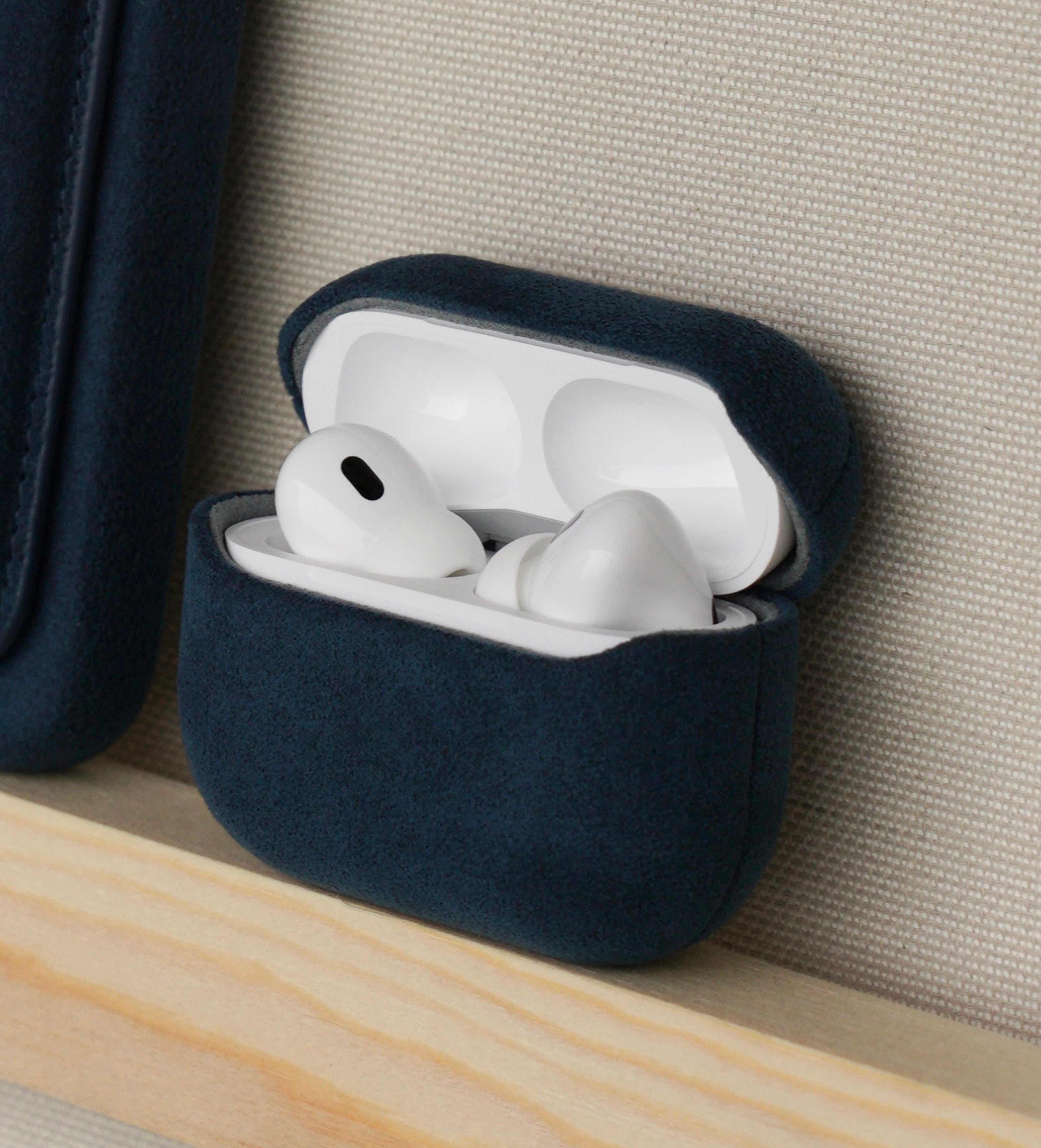Cantaracase Alcantara AirPods Pro case on shelf