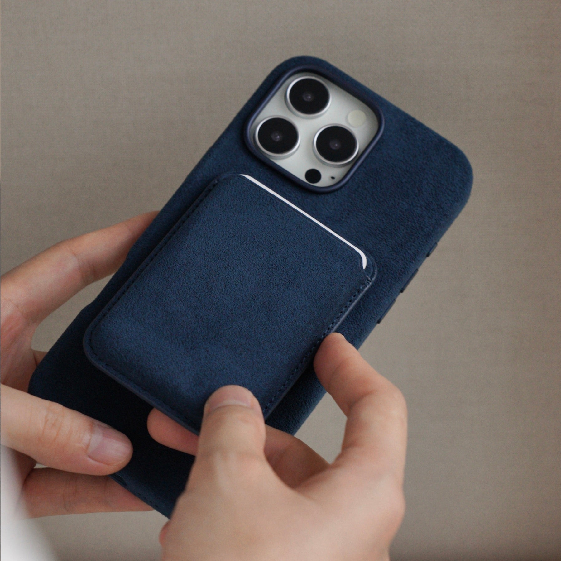 Cantaracase Alcantara iPhone case and MagSafe wallet in hand